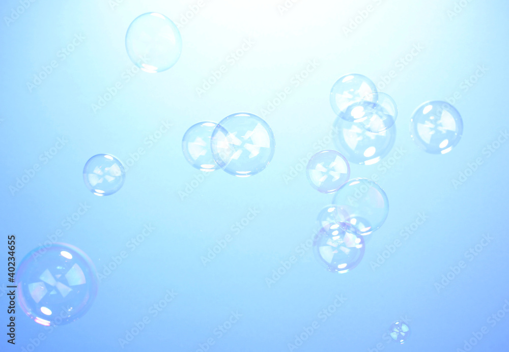 Soap bubble on blue background
