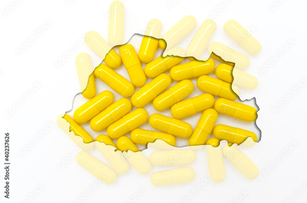 Outline map of bhutan with pills in the background for health an Outline map of bhutan with pills in the background for health an
