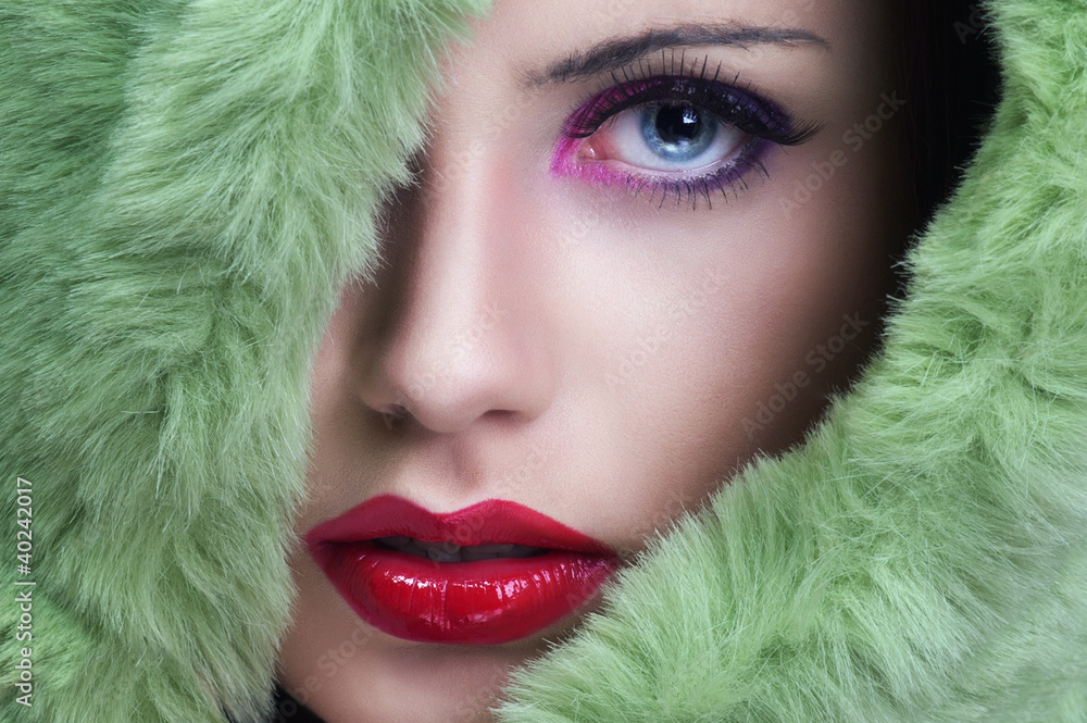 Portrait of young beautiful woman with green fur. - obrazy, fototapety, plakaty 