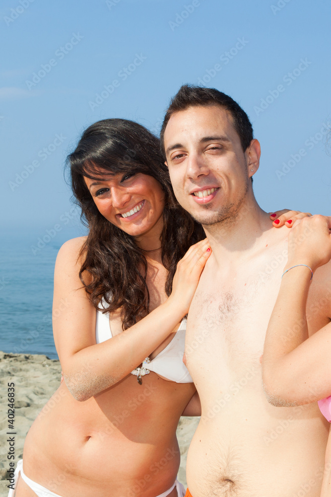 Happy Friends Embraced at Seaside