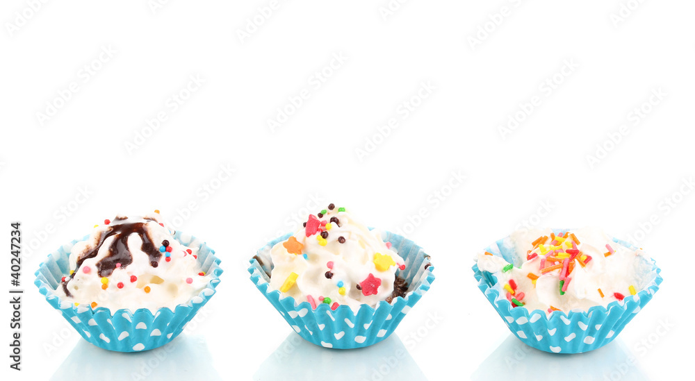 Creamy cupcakes isolated on white