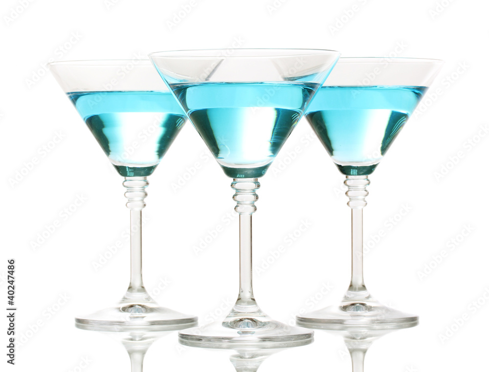 Blue cocktail in martini glasses isolated on white Blue cocktail in martini glasses isolated on white