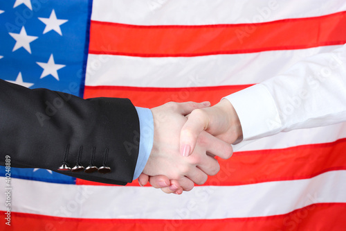 Business handshake on american flag background