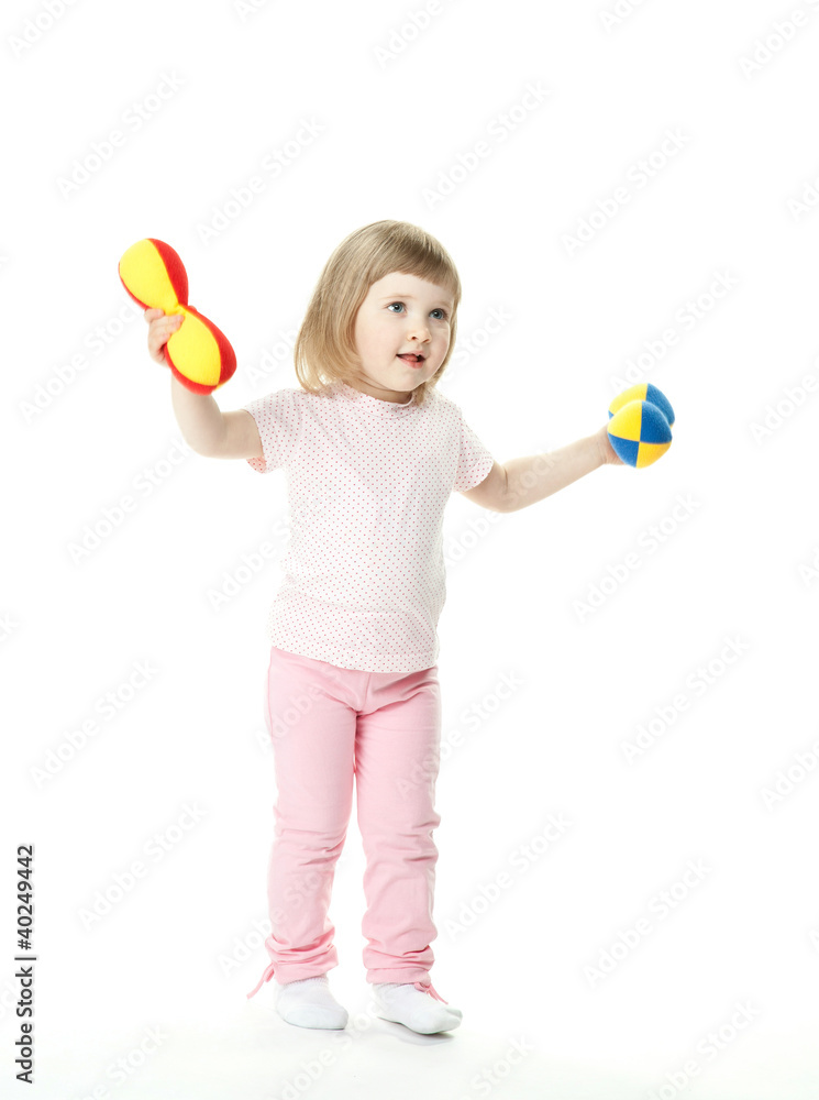 Cute little baby girl doing sport exercises with toy dumbbells Cute little baby girl doing sport exercises with toy dumbbells