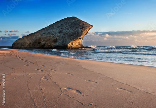 A landscape on sea with a rock