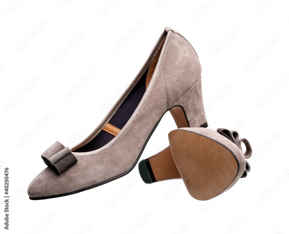 Pair of suede female shoes over white Pair of suede female shoes over white