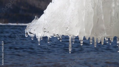 Icicle hanging over water