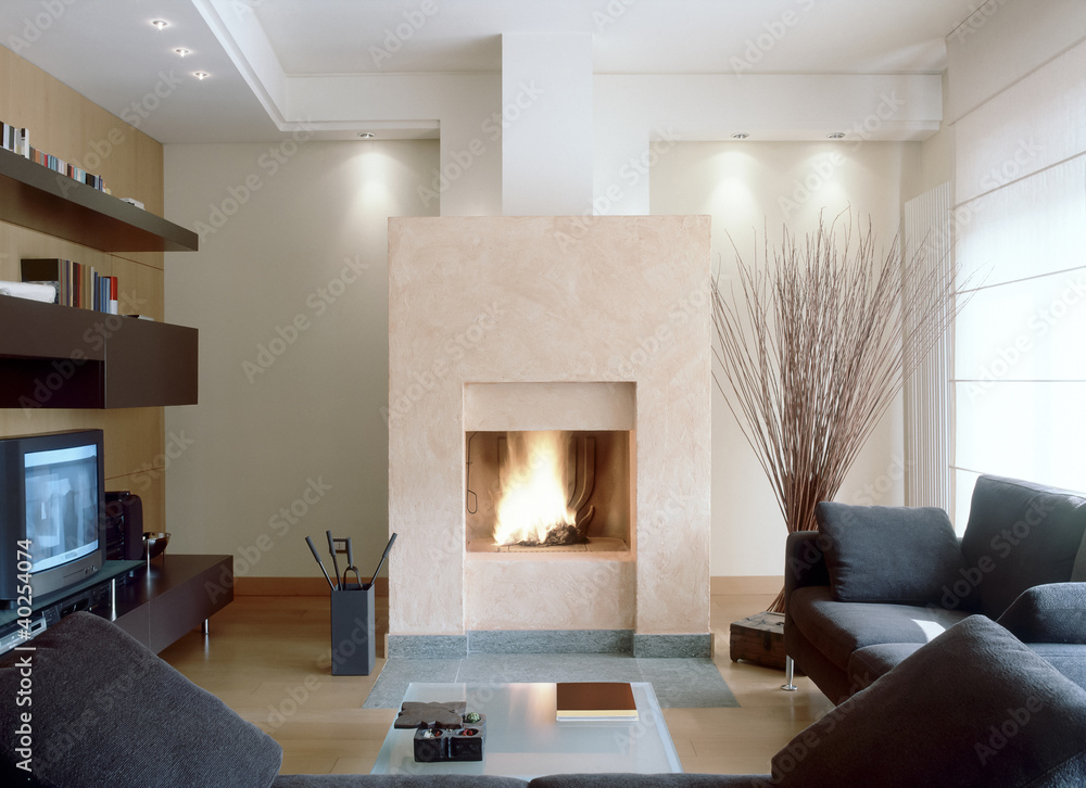 camino in moderno soggiorno con divano grigio Stock Photo | Adobe Stock