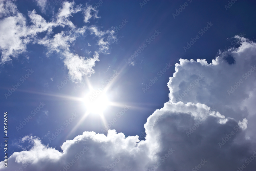 Sunbeam with blue sky and clouds