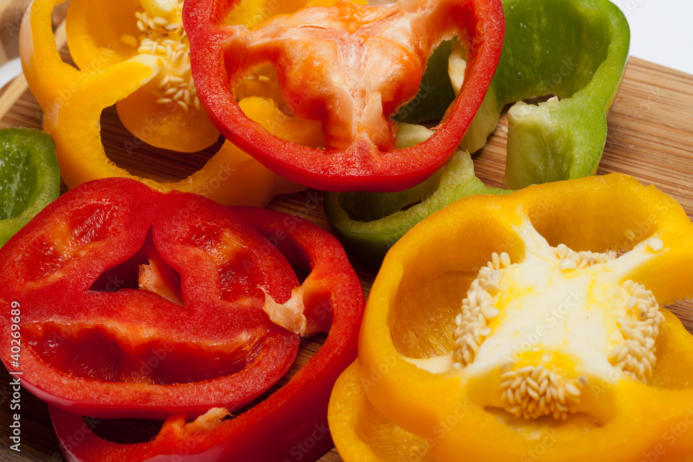 close up of red, yellow and green peppers close up of red, yellow and green peppers