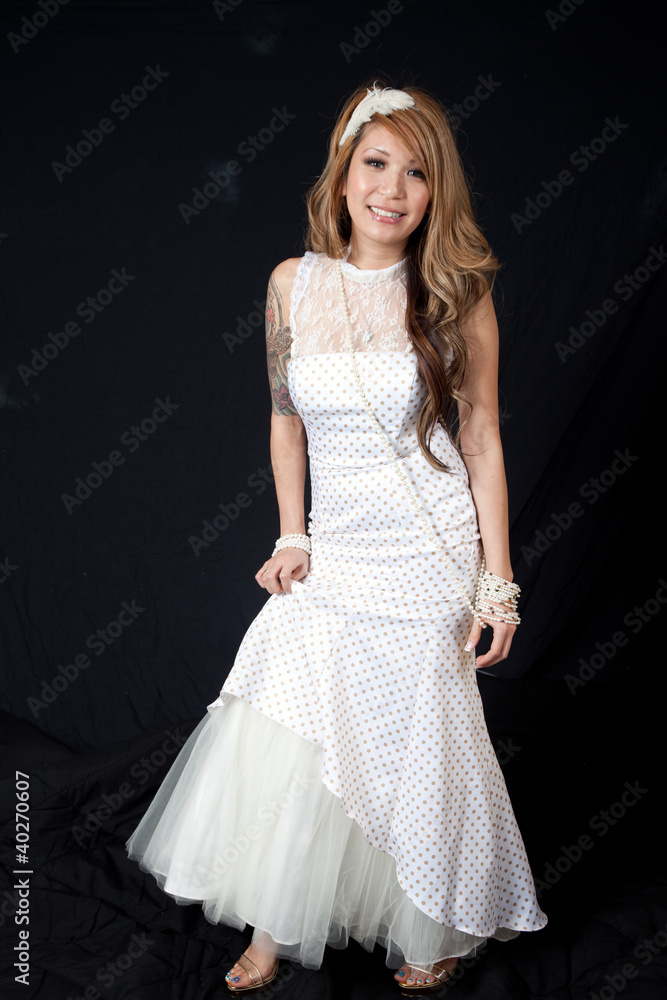 Naklejka premium Hispanic woman in white wedding dress