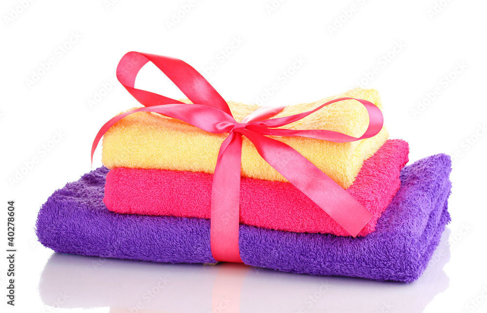 Colorful towels with ribbon isolated on white Colorful towels with ribbon isolated on white