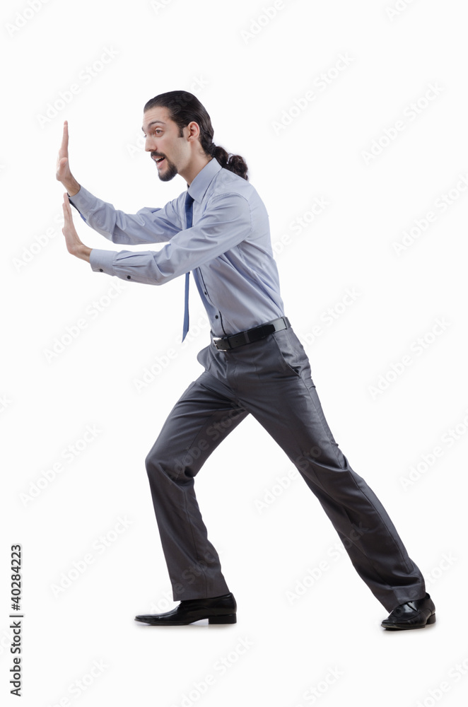 Businessman pushing away virtual obstacles Businessman pushing away virtual obstacles
