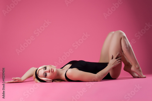 Sexy blond woman sport dress relax on floor