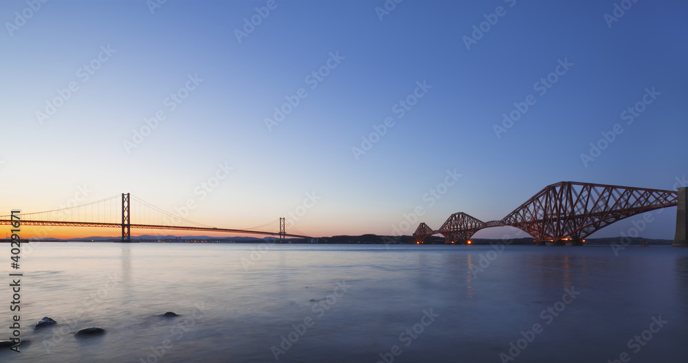 The Forth Road and Rail Bridges at night dusk