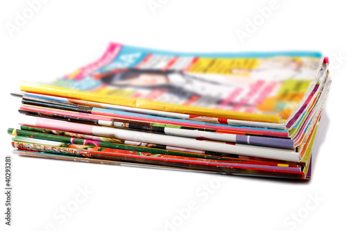 stack of old colored magazines photo