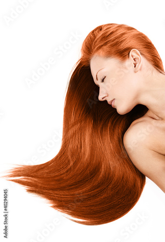young woman with long healthy shiny red hair