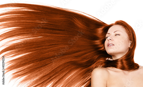 young beautiful woman with long healthy red hair