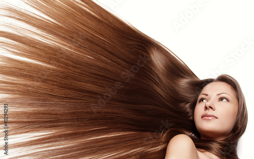 young woman with long shiny healthy hair