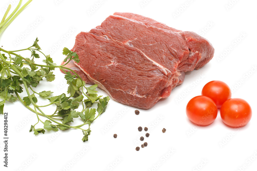 Piece of beef and vegetables on white