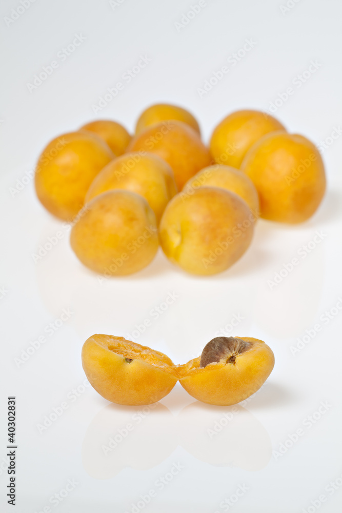 Fresh apricots, one cut in half