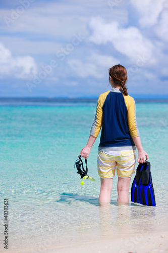 Woman holding snorkeling equipment