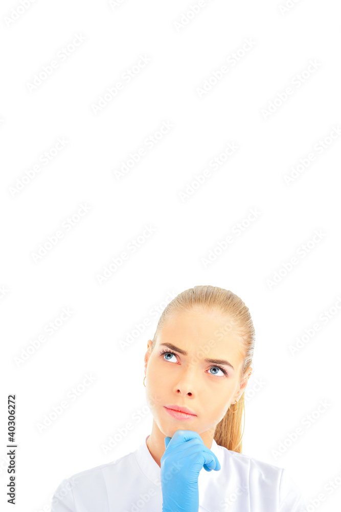 Thoughtful female doctor isolated over a white background Thoughtful female doctor isolated over a white background