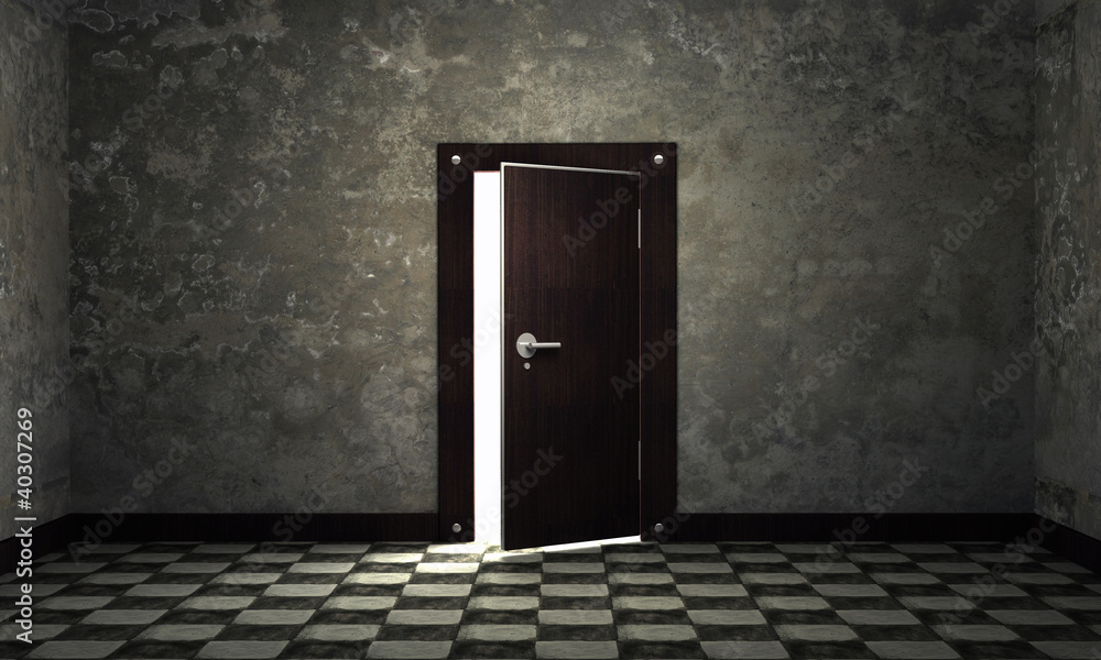 bright light through an open door in empty room bright light through an open door in empty room
