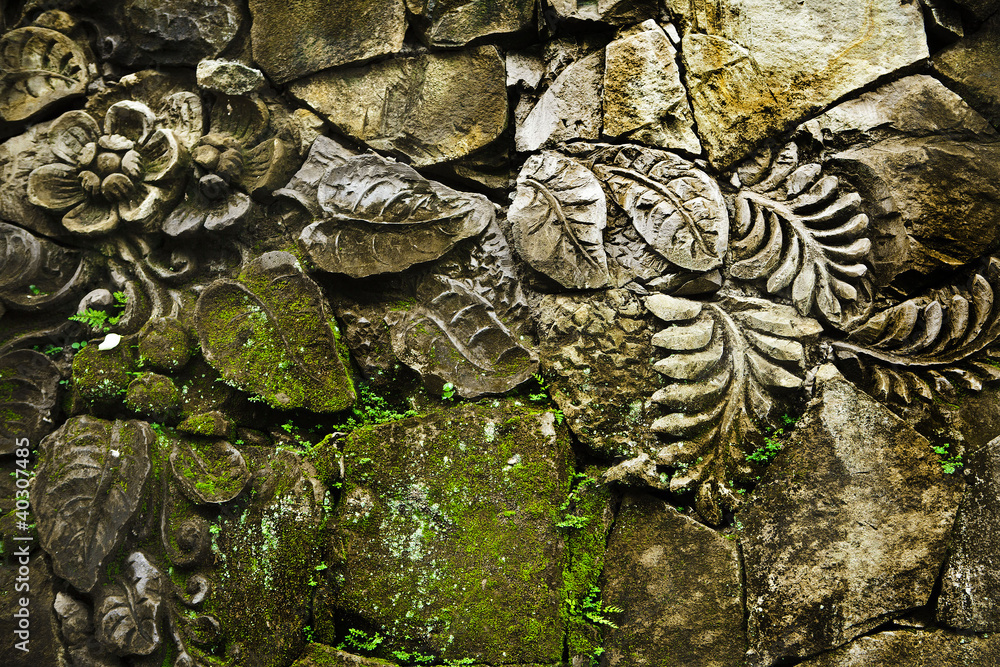 decorative carving flower ornament on stone wall
