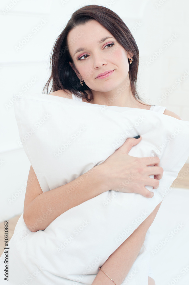 Studio portrait of a beautiful young woman relaxing in bed Studio portrait of a beautiful young woman relaxing in bed