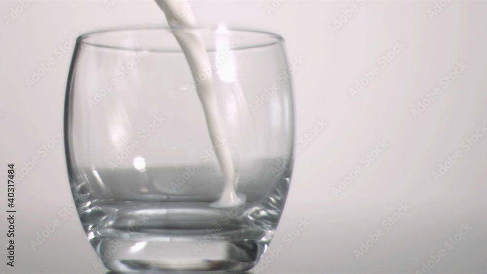 Milk poured in super slow motion Milk poured in super slow motion