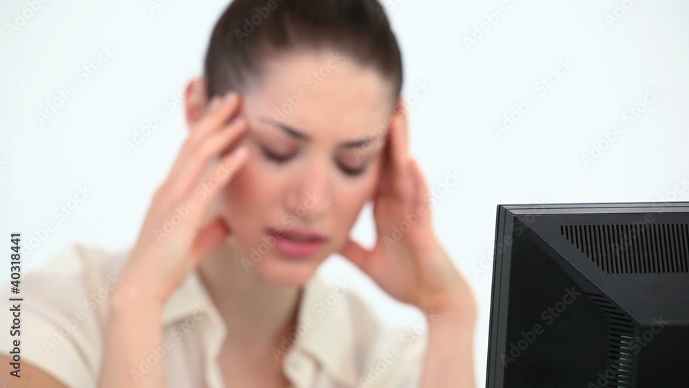Woman holding her head in her hands Woman holding her head in her hands