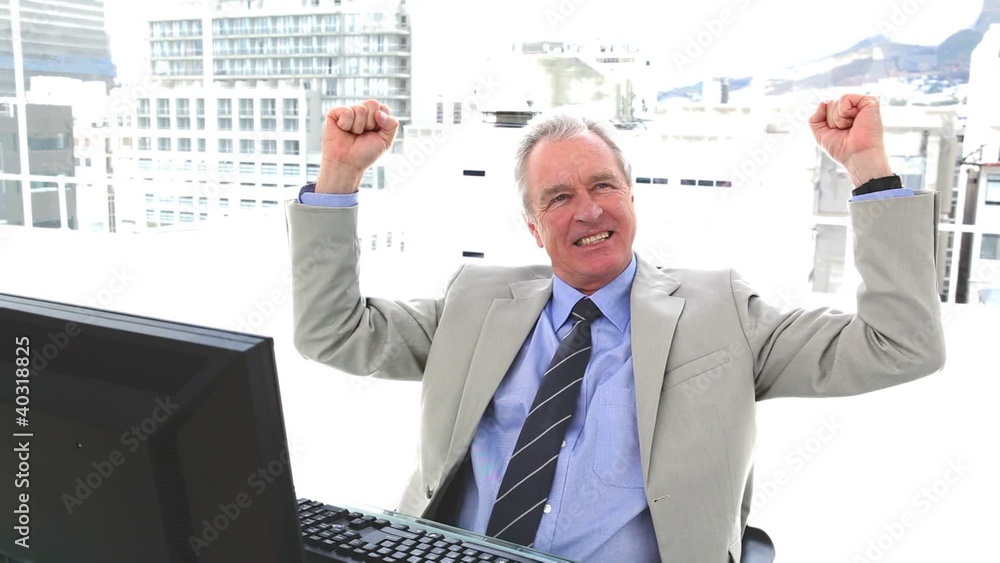 White hair businessman the fists raised White hair businessman the fists raised