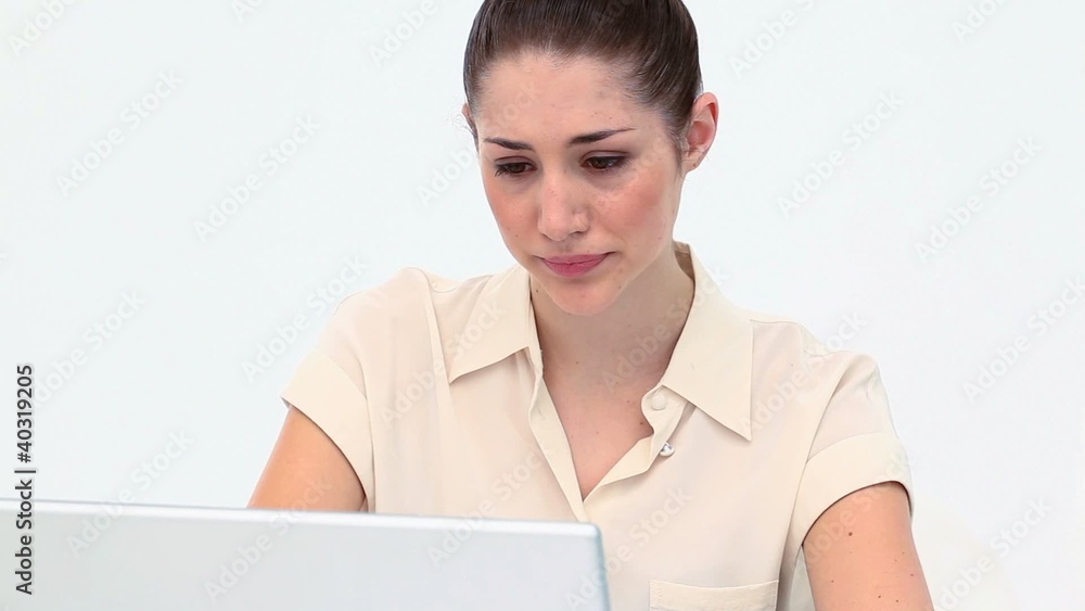 Depressed young woman using a laptop Depressed young woman using a laptop