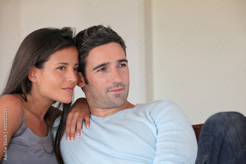 Fototapeta premium Couple relaxing at home in sofa