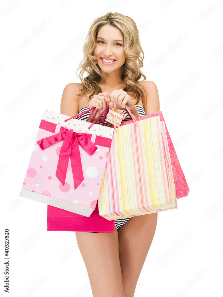 seductive woman in bikini with shopping bags seductive woman in bikini with shopping bags