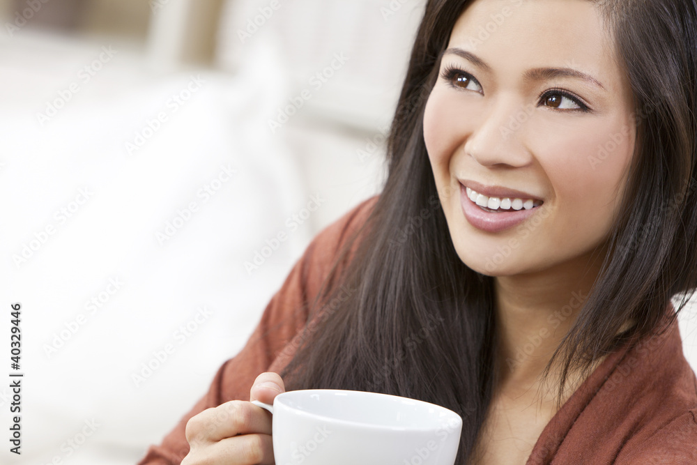 Beautiful Chinese Oriental Asian Woman Drinking Tea or Coffee Beautiful Chinese Oriental Asian Woman Drinking Tea or Coffee