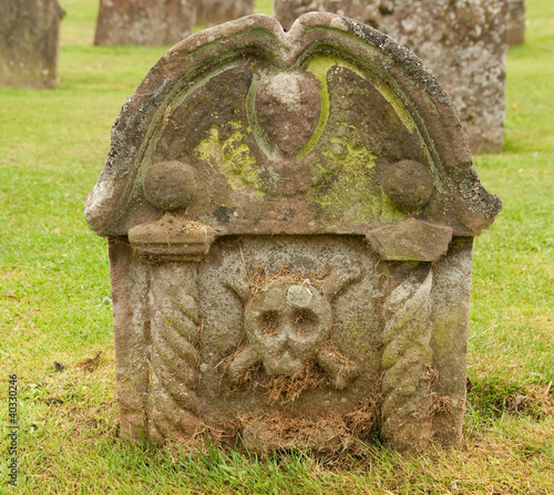 Old Scottish headstone with a skull