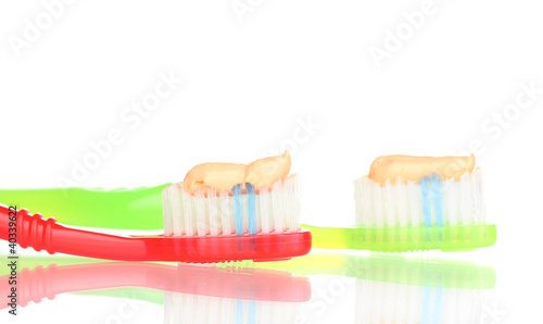 Toothbrushes with paste isolated on white