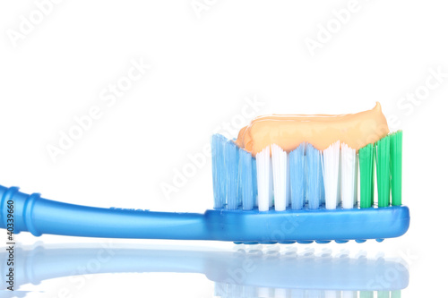 Toothbrush with paste isolated on white