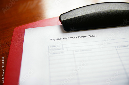 Business inventory tracking sheet on a clipboard photo