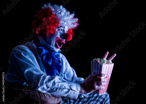 clown eating popcorn