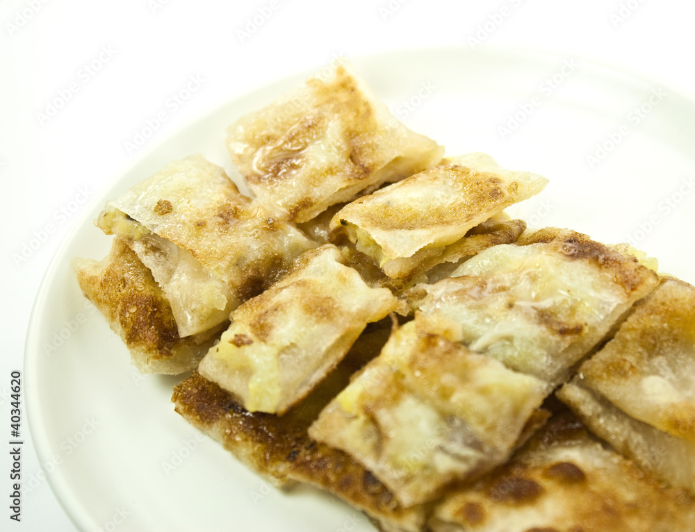 dessert style of fried roti with banana inside in Thailand dessert style of fried roti with banana inside in Thailand