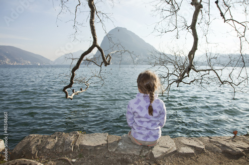 little girl by the lake photo