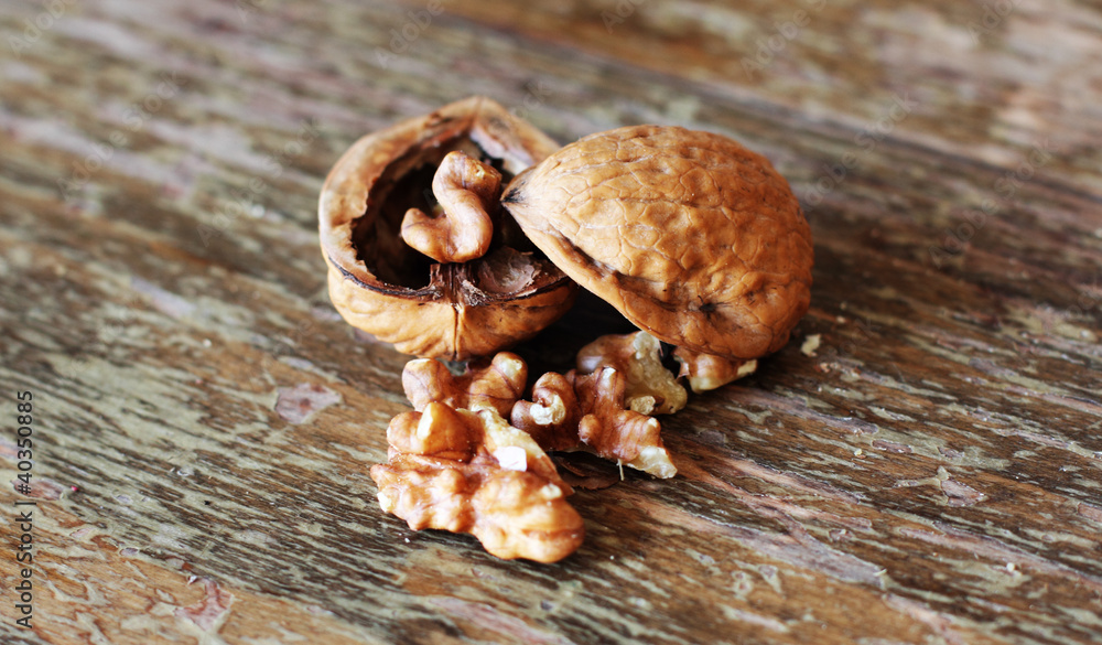 walnut on wooden background. soft focus