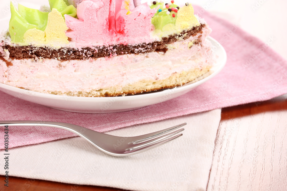 Creamy cake on saucer on table close-up Creamy cake on saucer on table close-up