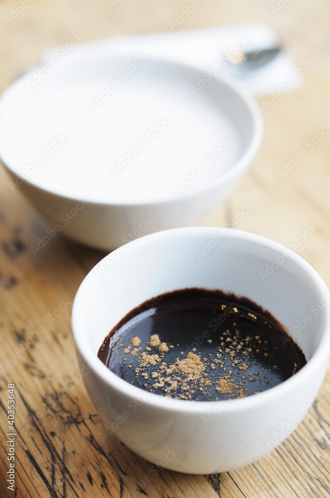Hot chocolate with spice and milk in white cups Hot chocolate with spice and milk in white cups