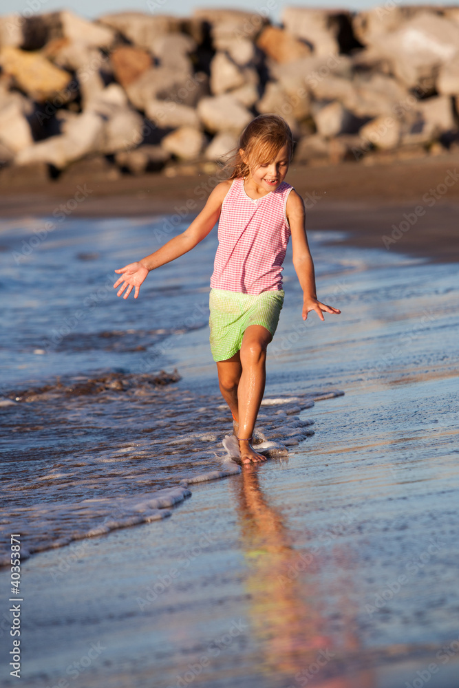 happy girl running by the ocean happy girl running by the ocean