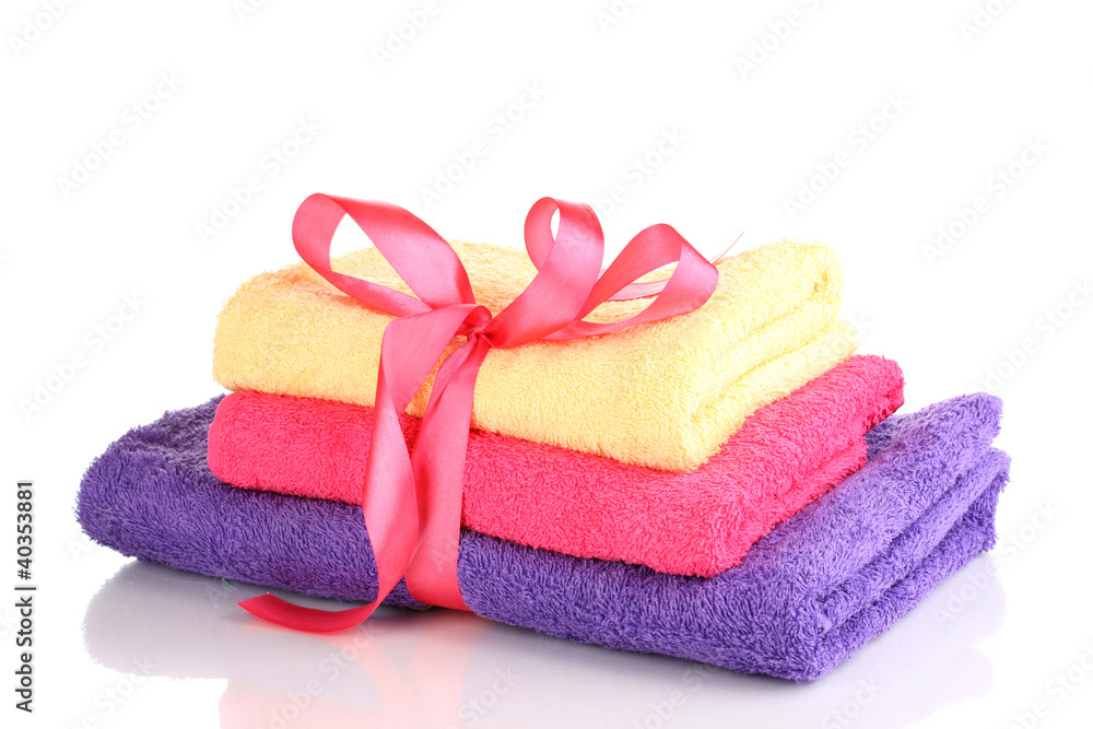 Colorful towels with ribbon isolated on white Colorful towels with ribbon isolated on white
