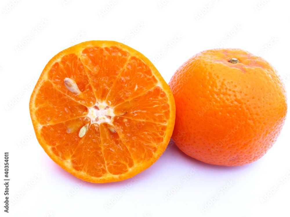 half sliced and one whole orange half sliced and one whole orange